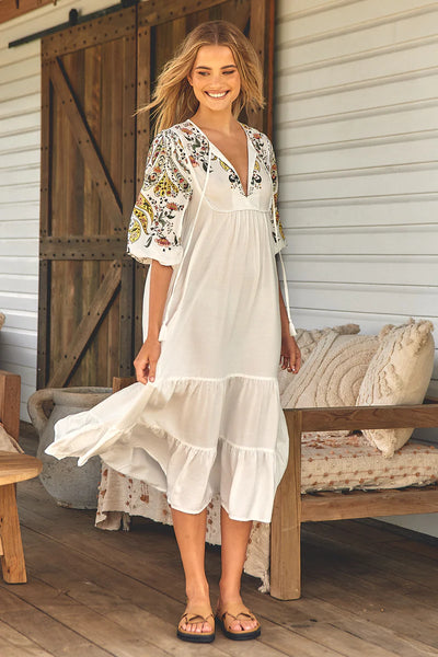 We are loving this Midi  Gorgeous billowing elbow length sleeves with elastic cuff   This midi is one of those throw on and go dresses, so easy to wear   Featuring piping detail on the bust line   Fabric ties with tassels   Slimline loose fit   Rayon fabrication 