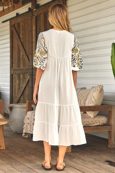 We are loving this Midi  Gorgeous billowing elbow length sleeves with elastic cuff   This midi is one of those throw on and go dresses, so easy to wear   Featuring piping detail on the bust line   Fabric ties with tassels   Slimline loose fit   Rayon fabrication 