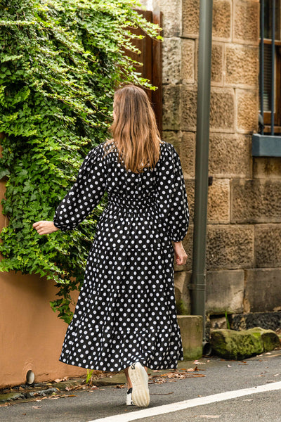 Gorgeous trans-seasonal dress from Boho Australia   We love a little polka dot especially black and white   Featuring a flattering V-Neckline   Smocked elasticated waist   Long sleeves   Maxi length   Inseam pockets   Cotton fabrication 