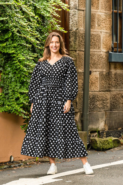 Gorgeous trans-seasonal dress from Boho Australia   We love a little polka dot especially black and white   Featuring a flattering V-Neckline   Smocked elasticated waist   Long sleeves   Maxi length   Inseam pockets   Cotton fabrication 