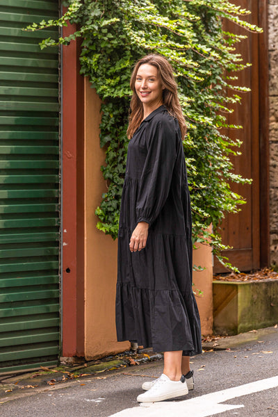 A gorgeous buttoned through Maxi from Boho Australia   Featuring a flattering V-Neckline   Tiered Maxi length skirt with side pockets   A loose relaxed style with long sleeves elasticated cuff  Perfect tran-seasonal maxi that could be cinched in at the waist or worn loosely   100% Cotton fabrication 