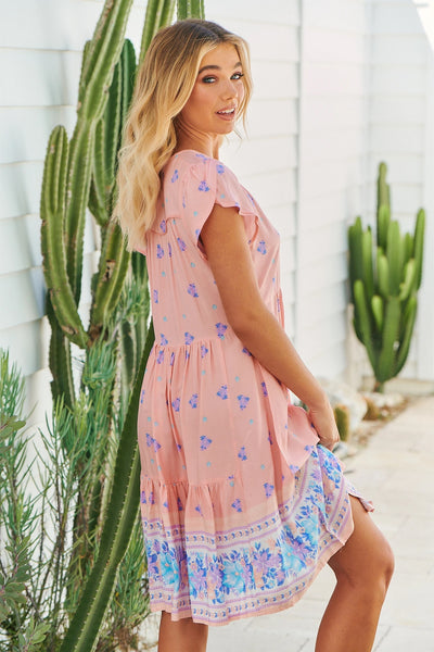 Such gorgeous pastel tones, the perfect Summer mini   Featuring a V-Neck  Piping details   Flutter capped sleeves   Empire waist   Tiered Skirt   Rayon fabrication    